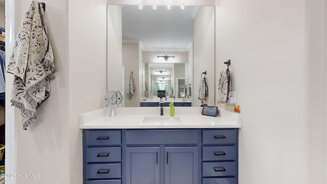 bathroom with vanity and crown molding