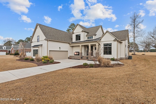 view of front of property with central AC unit, covered porch, and a front lawn