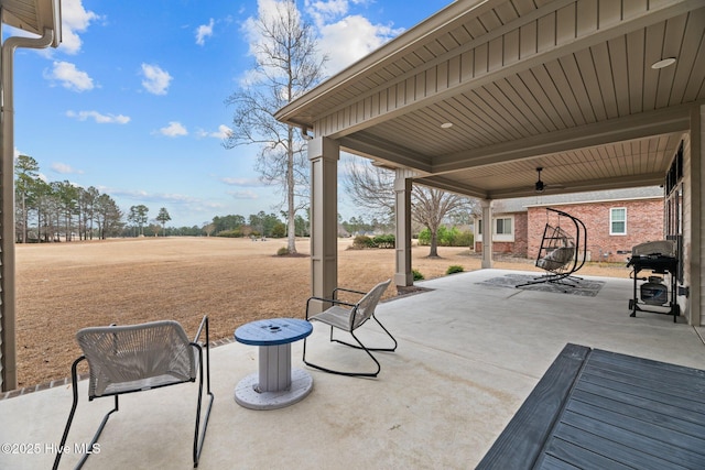 view of patio / terrace with ceiling fan and area for grilling