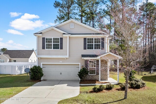 view of front of property with a garage and a front yard