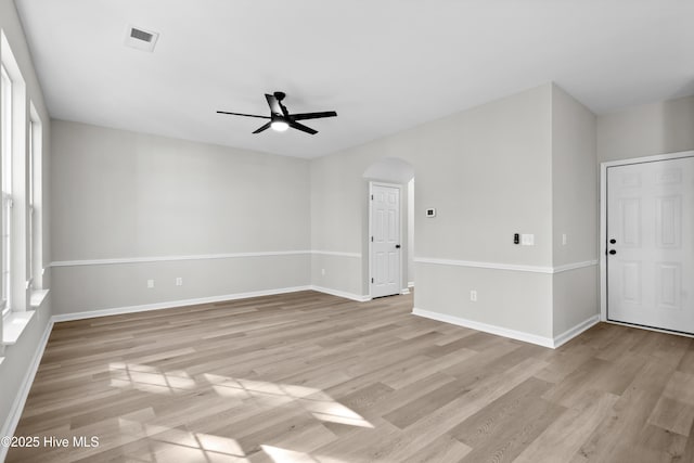 empty room with light wood-type flooring and ceiling fan