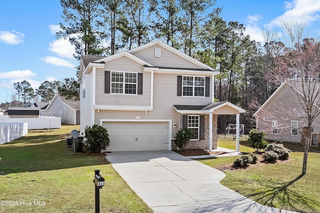 view of property featuring a front yard and a garage