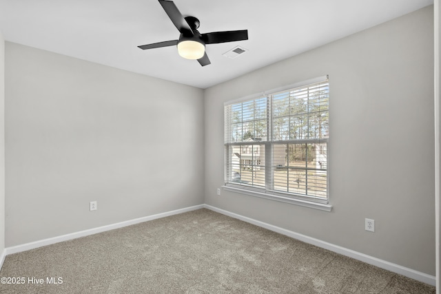 empty room featuring ceiling fan and carpet floors