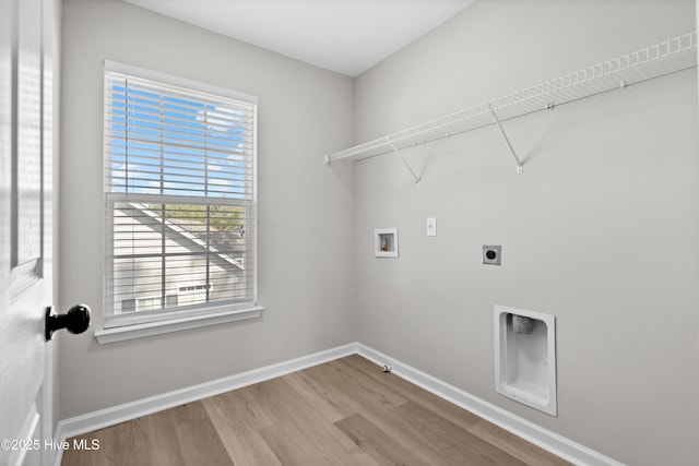 laundry area with hardwood / wood-style floors, hookup for a washing machine, and electric dryer hookup