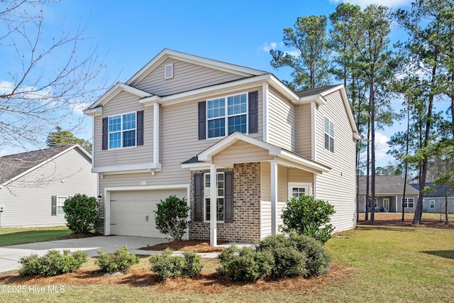 view of front of home with a front lawn and a garage