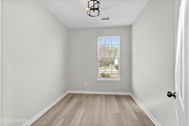 unfurnished room with light hardwood / wood-style floors