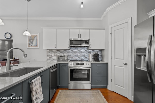 kitchen featuring gray cabinetry, appliances with stainless steel finishes, sink, and white cabinets