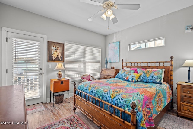 bedroom with hardwood / wood-style floors, ceiling fan, and access to exterior