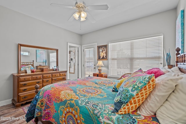 bedroom with ceiling fan and light hardwood / wood-style flooring