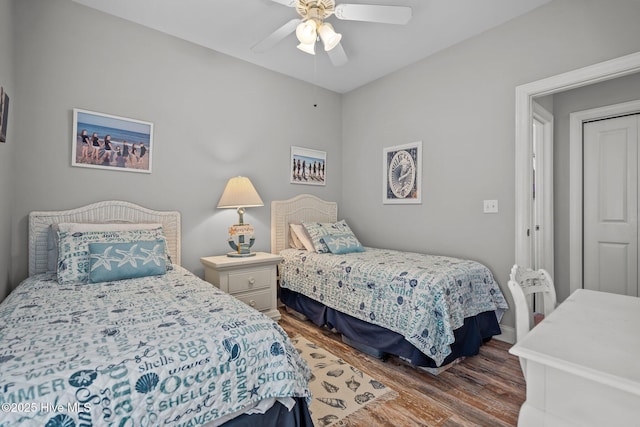 bedroom with hardwood / wood-style flooring and ceiling fan