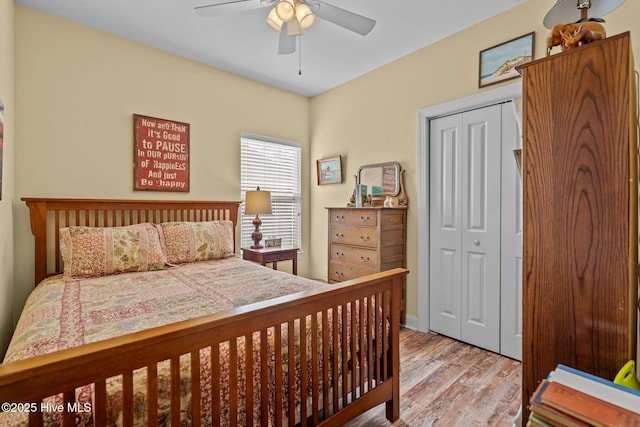 bedroom featuring ceiling fan, light hardwood / wood-style floors, and a closet