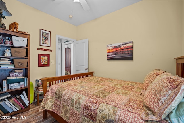 bedroom featuring ceiling fan and wood-type flooring