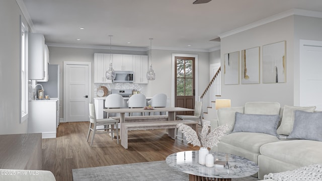 living room with crown molding and hardwood / wood-style floors