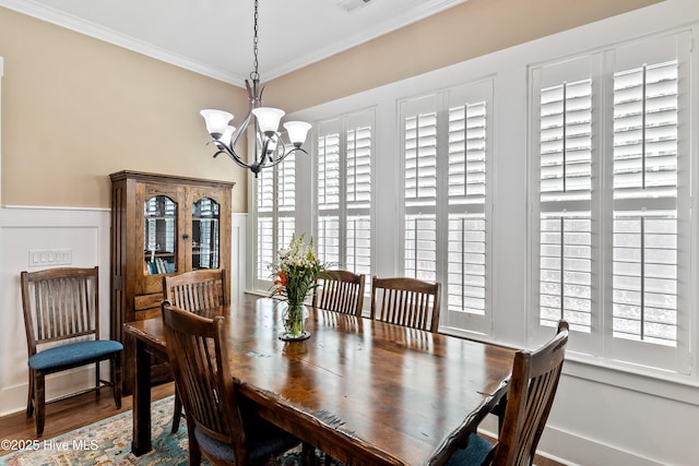3604 Haughton Ln, Castle Hayne, NC 28429 - dining room featuring a chandelier, crown molding, and wood finished floors