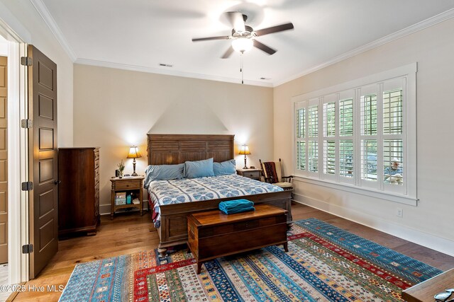 3604 Haughton Ln, Castle Hayne, NC 28429 - bedroom with light wood finished floors, ornamental molding, baseboards, and ceiling fan
