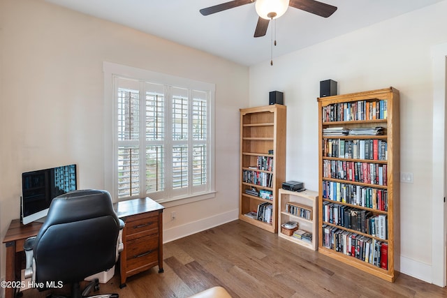 3604 Haughton Ln, Castle Hayne, NC 28429 - home office featuring ceiling fan, wood finished floors, and baseboards
