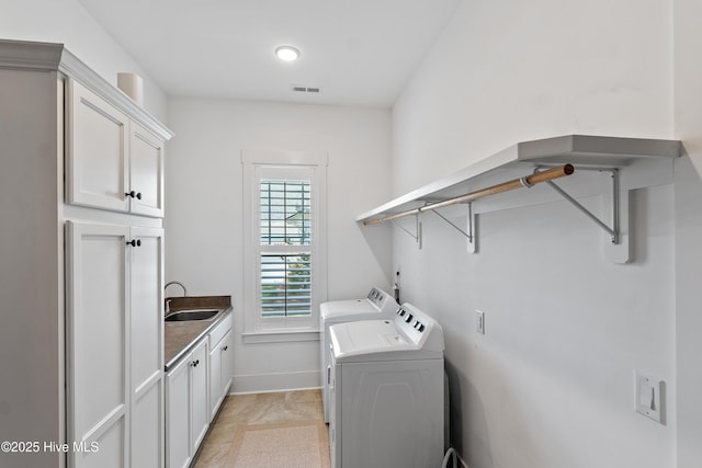 3604 Haughton Ln, Castle Hayne, NC 28429 - laundry room featuring cabinet space, washing machine and clothes dryer, and baseboards