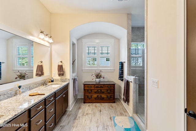 3604 Haughton Ln, Castle Hayne, NC 28429 - bathroom with vanity, a shower stall, and wood finished floors