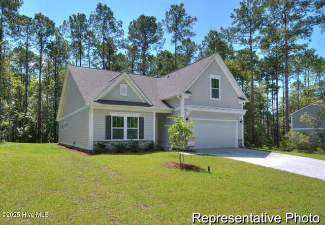 view of front of property with a garage and a front yard