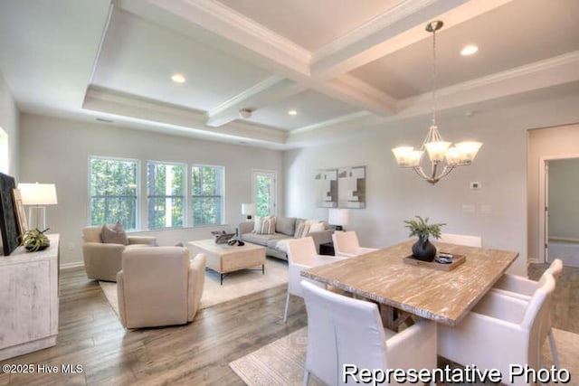 dining room with coffered ceiling, a chandelier, ornamental molding, beam ceiling, and light hardwood / wood-style floors