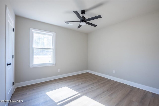 unfurnished room with ceiling fan and light wood-type flooring