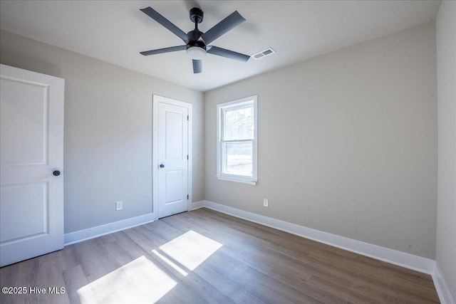 unfurnished bedroom with ceiling fan and light hardwood / wood-style flooring