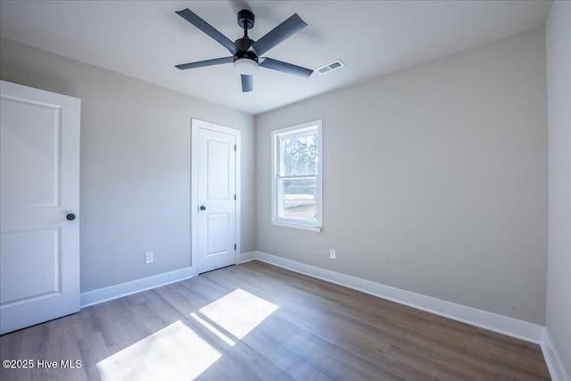 unfurnished bedroom with ceiling fan and light wood-type flooring