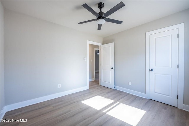 unfurnished bedroom featuring light hardwood / wood-style flooring and ceiling fan