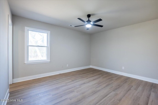 empty room featuring ceiling fan and light wood-type flooring