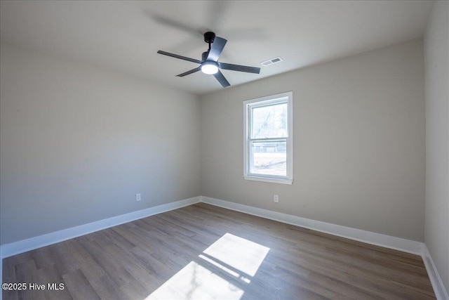 empty room featuring ceiling fan and light wood-type flooring