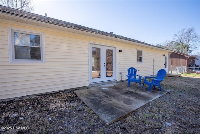 back of house with a patio and french doors