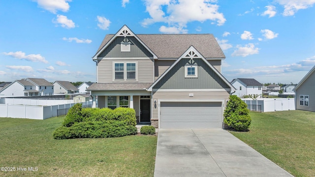 craftsman inspired home featuring fence, a front lawn, an attached garage, a shingled roof, and concrete driveway