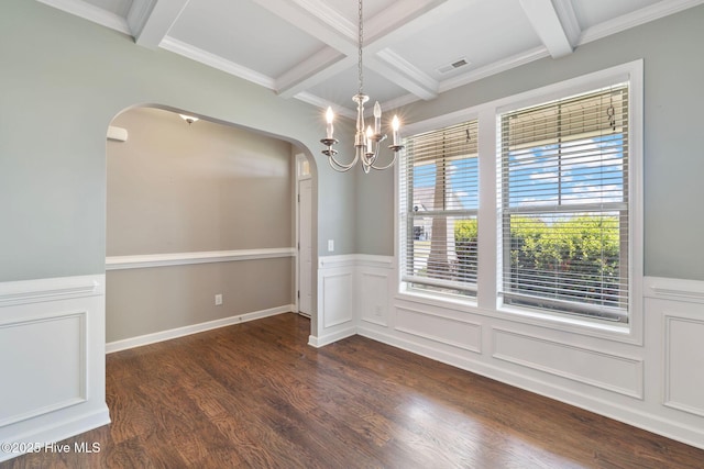 unfurnished dining area with visible vents, arched walkways, a notable chandelier, dark wood-type flooring, and coffered ceiling