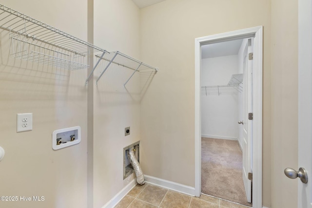 washroom featuring light tile patterned floors, baseboards, washer hookup, laundry area, and electric dryer hookup