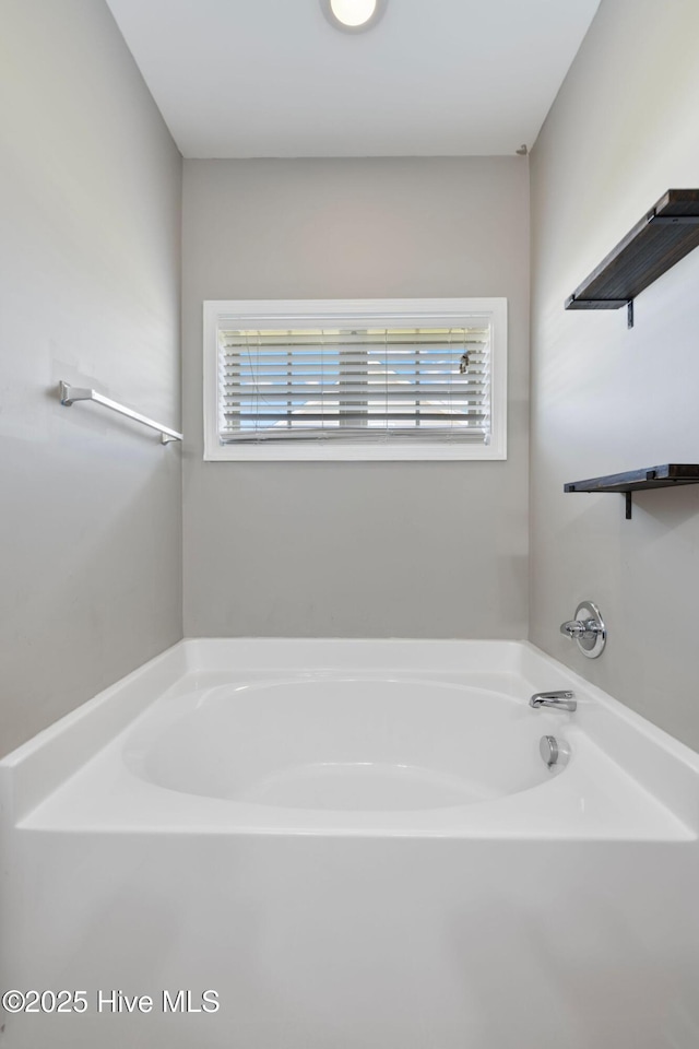 bathroom with a garden tub