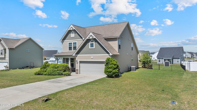 craftsman inspired home with concrete driveway, central air condition unit, a front yard, a garage, and fence