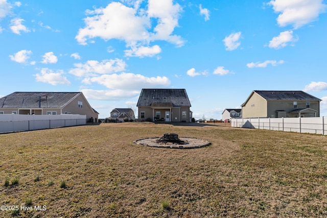 view of yard with an outdoor fire pit