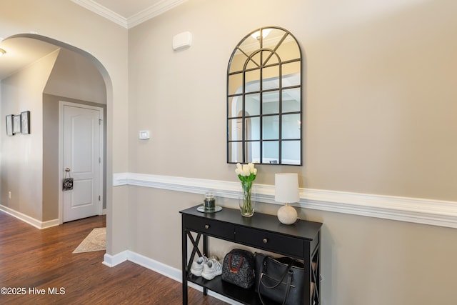 hall with ornamental molding and dark hardwood / wood-style flooring