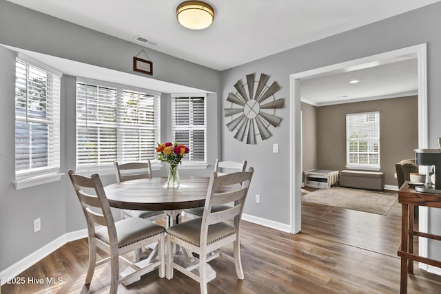 dining area featuring hardwood / wood-style floors