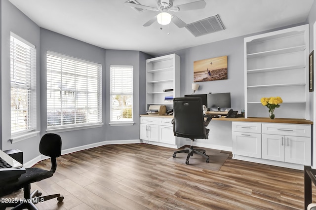 office space featuring ceiling fan and light hardwood / wood-style flooring