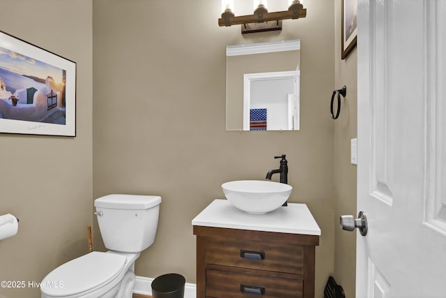 bathroom featuring vanity and toilet