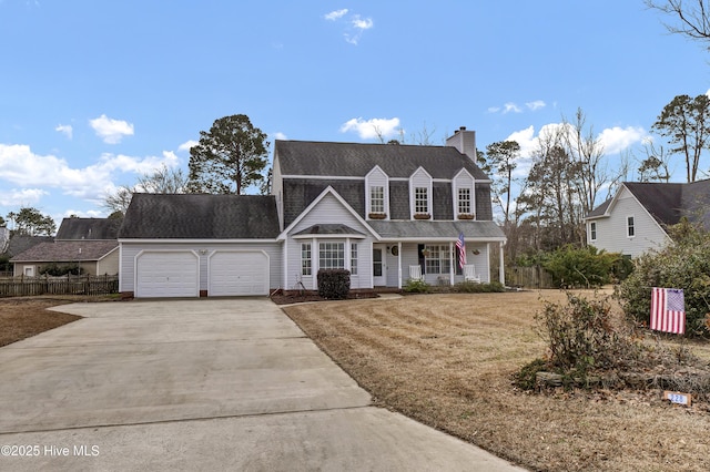 view of front facade with a garage, covered porch, and a front lawn