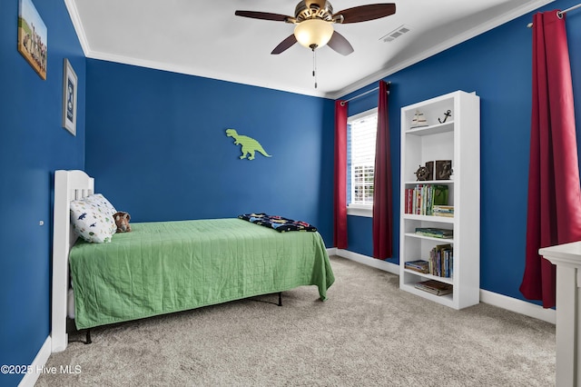 carpeted bedroom with crown molding and ceiling fan