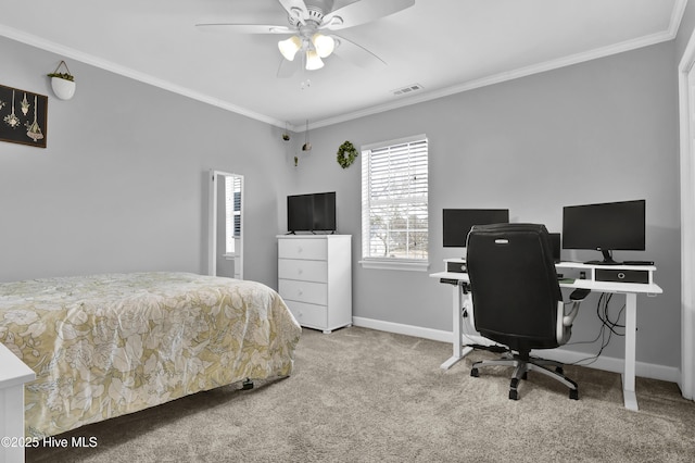 carpeted bedroom with ceiling fan and ornamental molding