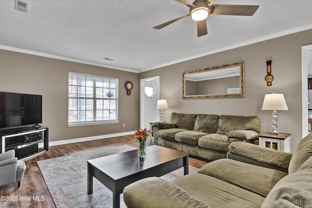 living room featuring ornamental molding, dark hardwood / wood-style floors, ceiling fan, and a textured ceiling