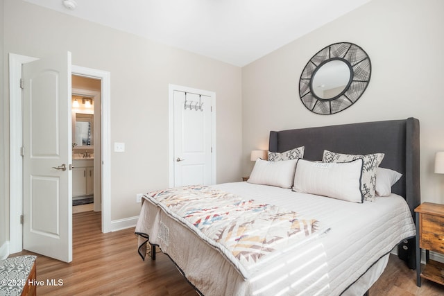 bedroom with hardwood / wood-style flooring