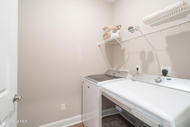 laundry room with washer and clothes dryer