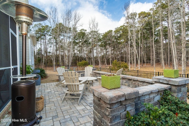 view of patio / terrace with an outdoor fire pit