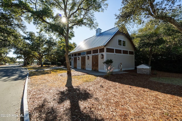 view of front of home featuring an outbuilding