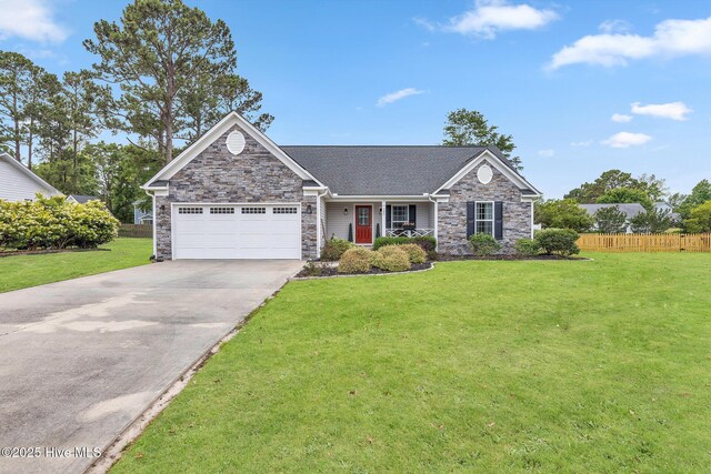 view of front of house featuring stone siding, an attached garage, and driveway